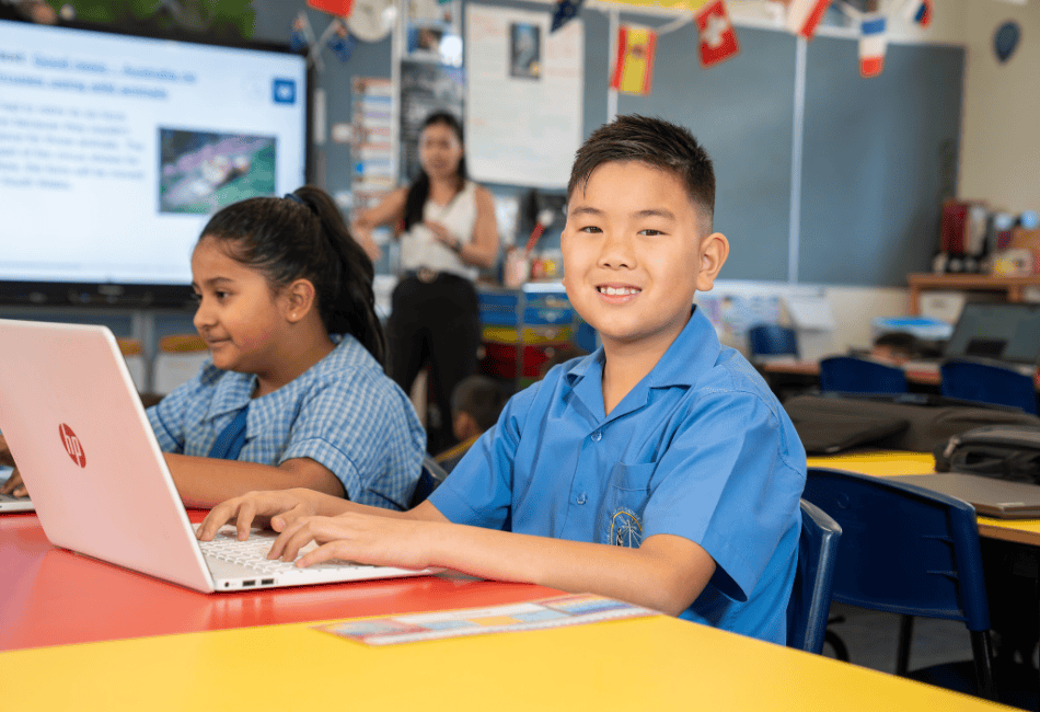 Two students from Immaculate Heart of Mary Catholic Primary School in Sefton enjoying a lesson in the classroom